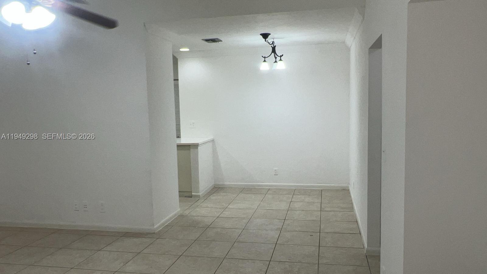 1802 Waterview Circle, Unit 1802 Palm Springs, FL 33461 - Photo 13 of 20 an empty room with a bathroom