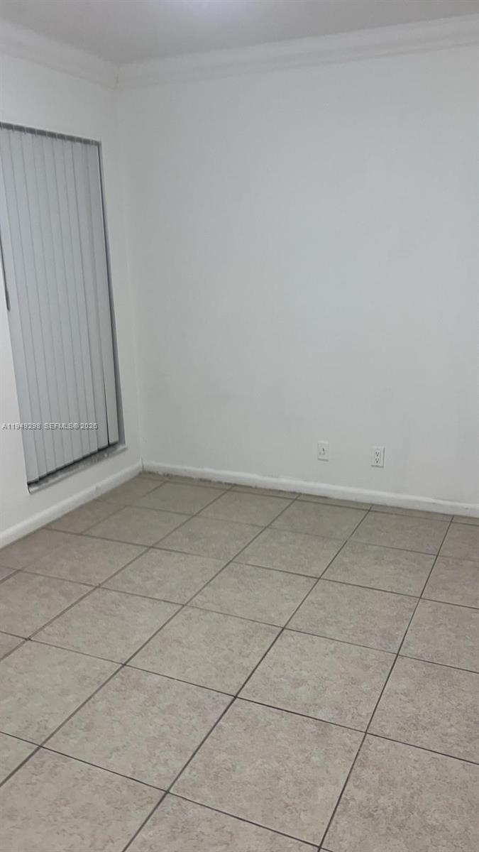 1802 Waterview Circle, Unit 1802 Palm Springs, FL 33461 - Photo 10 of 20 an empty room with a bench and cabinet