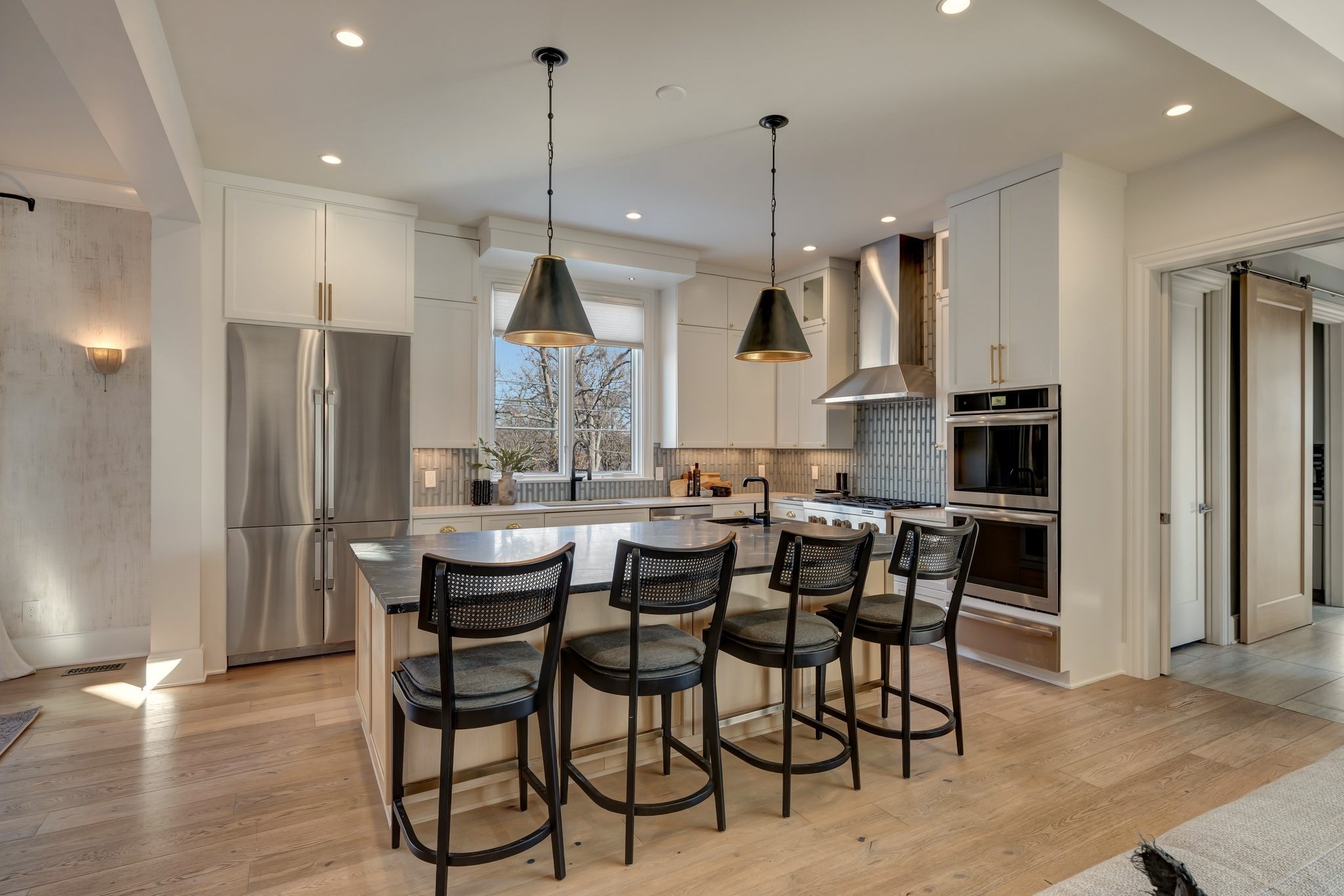 3500 Stokesmont Road Nashville, TN 37215 - Photo 13 of 75 a dining area with stainless steel appliances kitchen island granite countertop a dining table chairs and sink