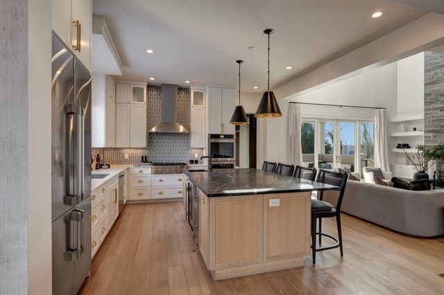 a view of walk in closet with clothes