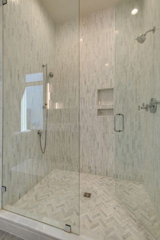 a bathroom with a granite countertop sink a vanity and a window