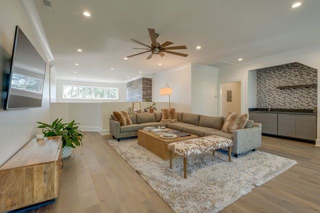a living room with furniture gym equipment and a view of living room