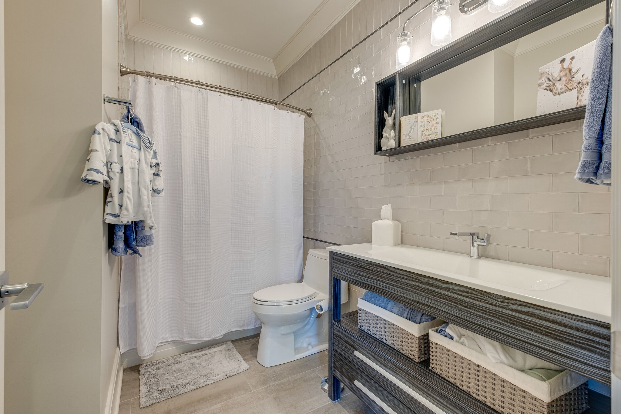 3500 Stokesmont Road Nashville, TN 37215 - Photo 43 of 75 a bathroom with a sink a toilet and shower curtain