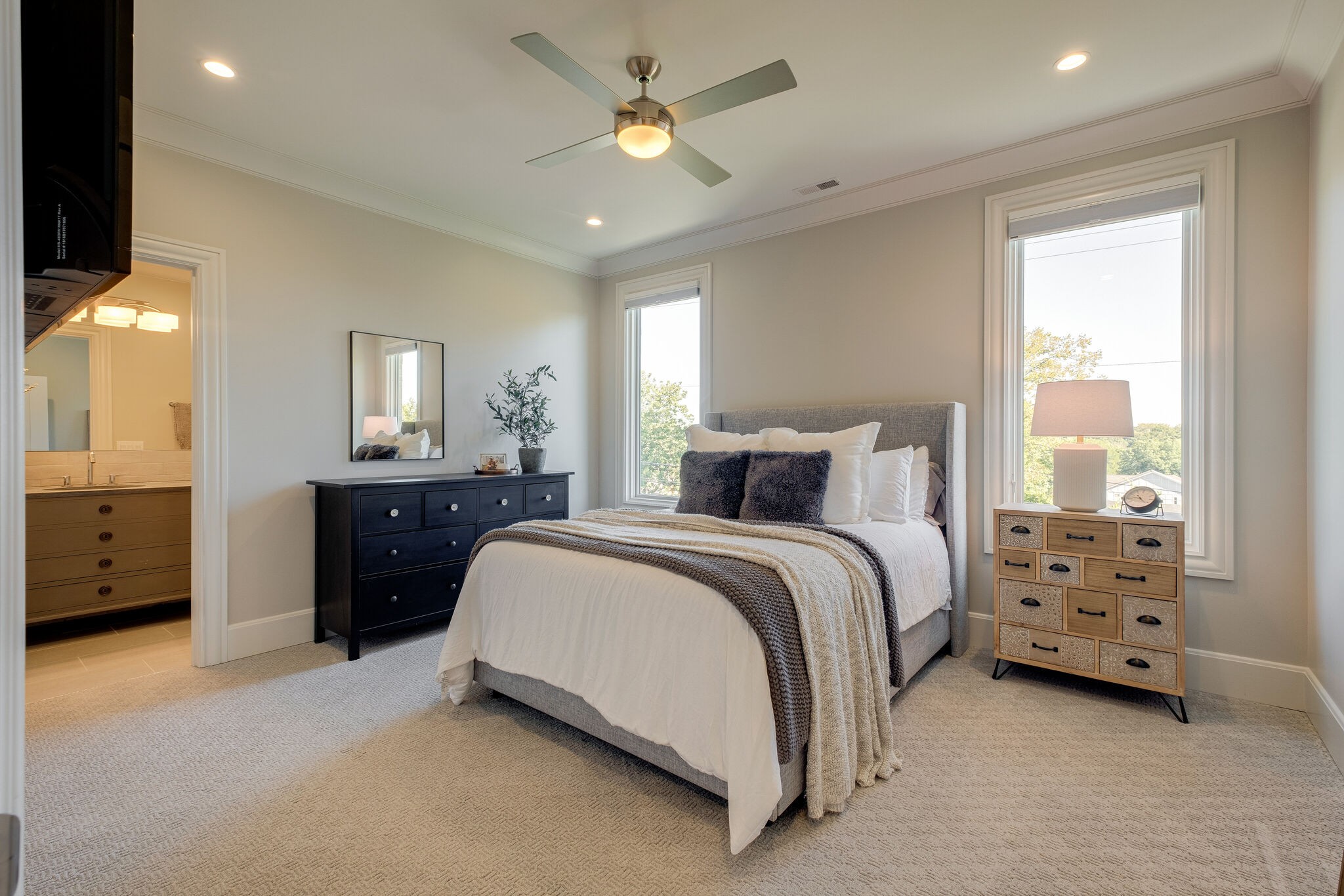 3500 Stokesmont Road Nashville, TN 37215 - Photo 44 of 75 a spacious bedroom with a bed and a chandelier