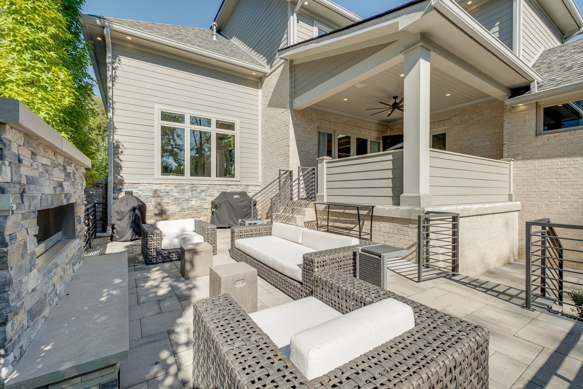 3500 Stokesmont Road Nashville, TN 37215 - Photo 58 of 75 a view of a patio with couches table and chairs with wooden floor and fence
