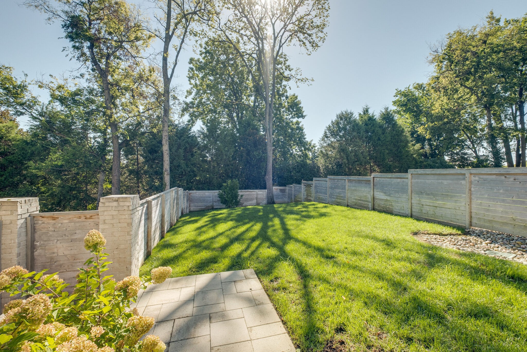 3500 Stokesmont Road Nashville, TN 37215 - Photo 60 of 75 a view of a backyard with large trees and wooden fence