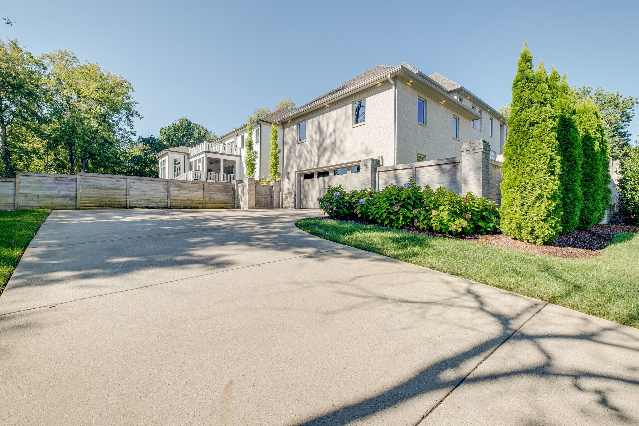 3500 Stokesmont Road Nashville, TN 37215 - Photo 63 of 75 a view of a white house with a small yard and a large parking space