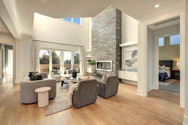 a kitchen with granite countertop a sink stainless steel appliances and cabinets