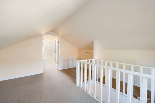 a view of an empty room with stairs