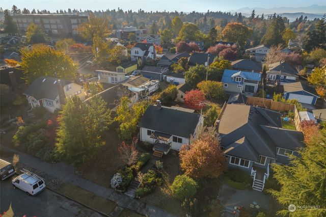 an aerial view of a house with a lake view