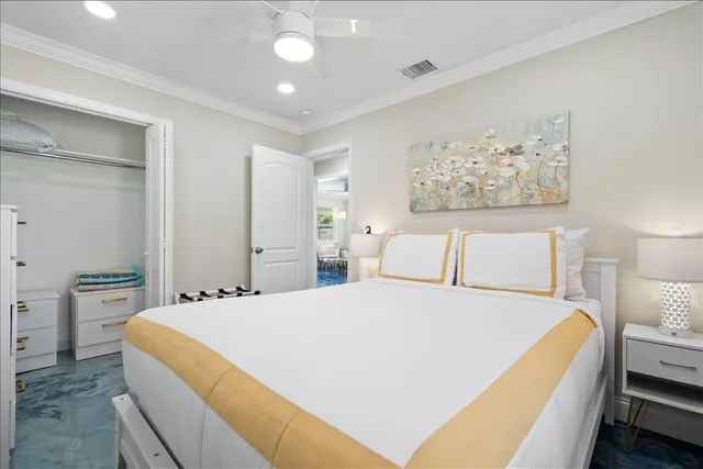 a spacious bedroom with a bed and a large mirror