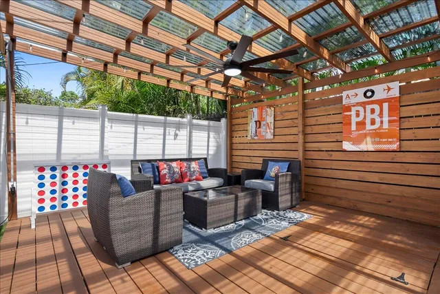 a view of a patio with couches and potted plants