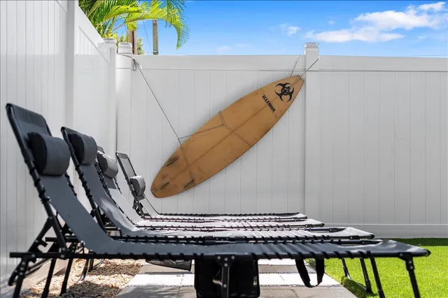 a view of a chairs and table in the patio