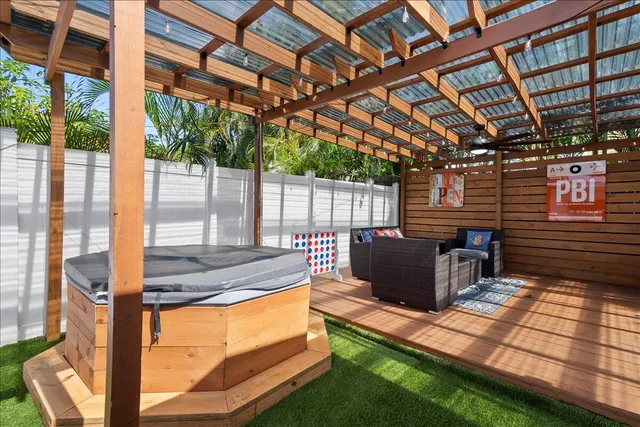 a view of a backyard with sitting area