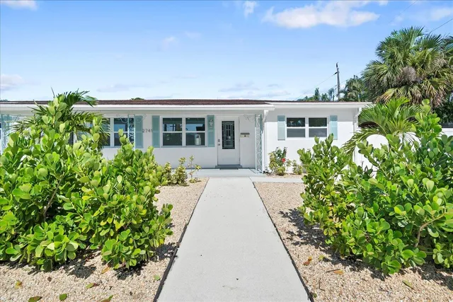 front view of a house with a yard