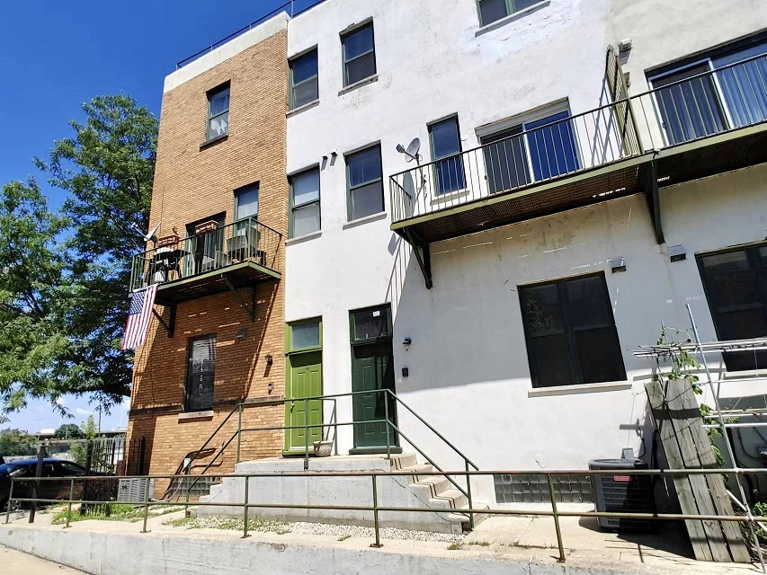 3131 South Benson Street, Unit 10 Chicago, IL 60608 - Photo 2 of 17 a view of a building with many windows