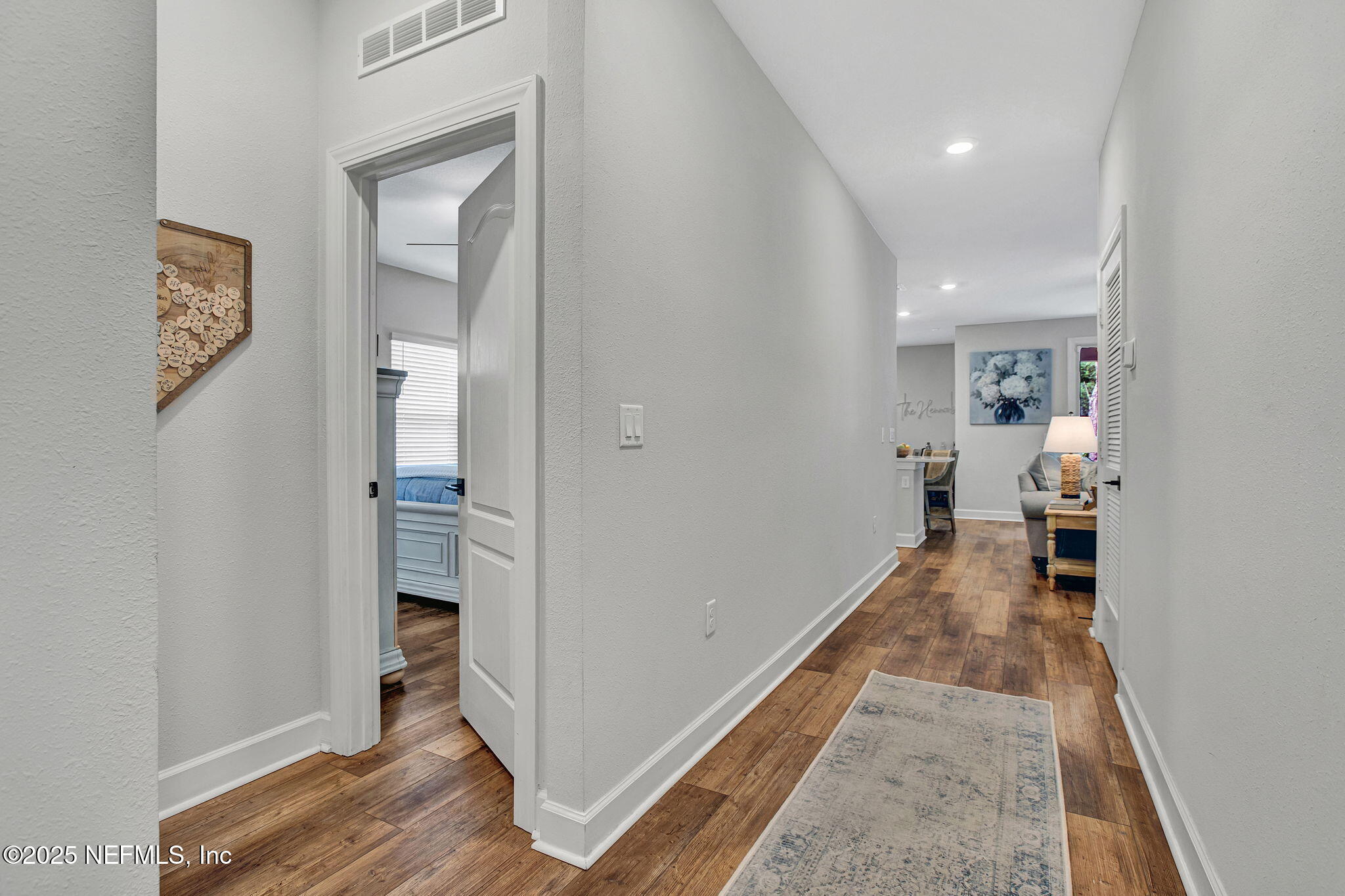 728 Morgans Treasure Road St. Augustine, FL 32084 - Photo 12 of 25 Hallway with Primary Bedroom