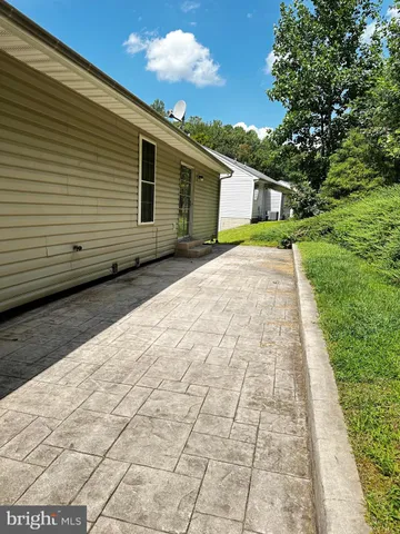 a view of a backyard of the house