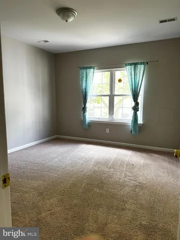 en empty room with windows