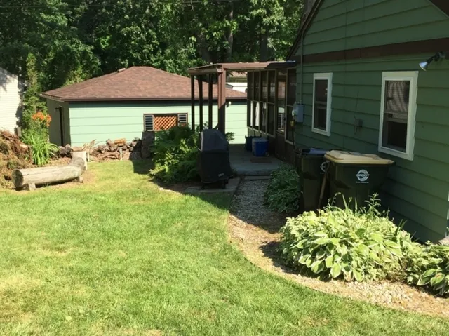 a front view of a house with garden