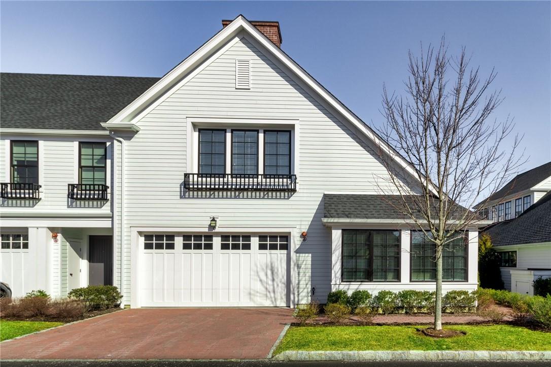9 Rose Lane Rye Brook, NY 10573 - Photo 1 of 1 a front view of a house with a yard and garage