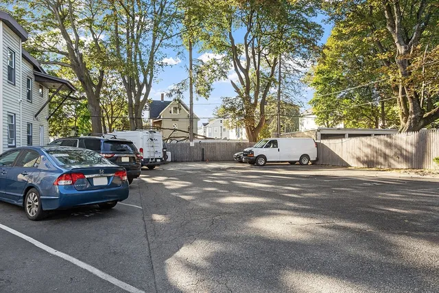 a view of street with parked cars