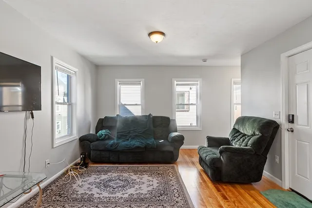 a living room with furniture and a rug