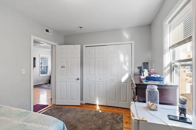 a kitchen with a refrigerator and a stove top oven