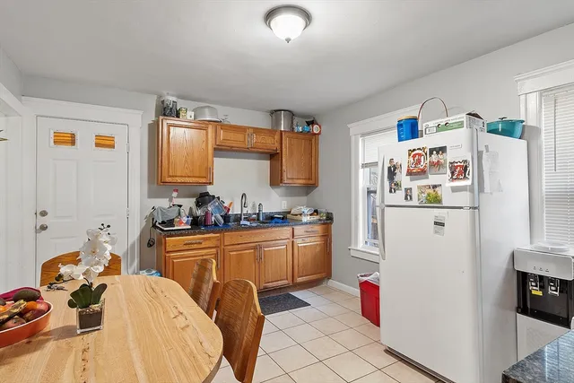 a view of a kitchen with a refrigerator and a stove