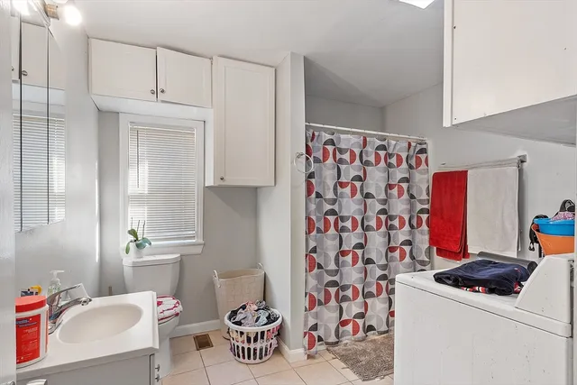 a bed room with furniture and a flat screen tv