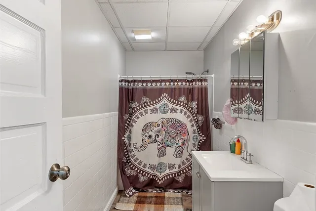 a kitchen with stainless steel appliances granite countertop a sink a stove and cabinets