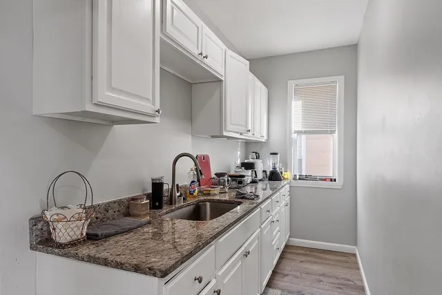 a bedroom with a bed and dresser