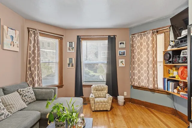 a bedroom with a bed and flat screen tv