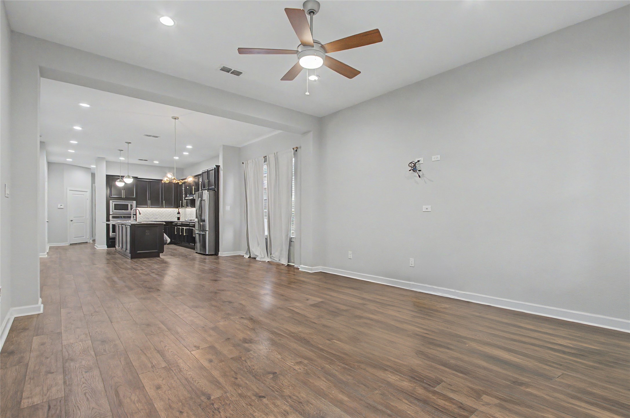 19718 Shinnery Ridge Court Cypress, TX 77433 - Photo 8 of 23 a view of an empty room with a ceiling fan