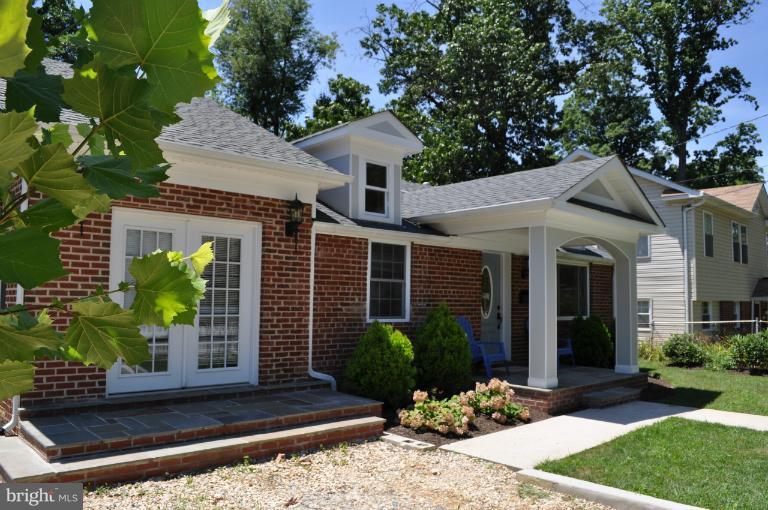 2916 Weisman Road Silver Spring, MD 20902 - Photo 1 of 19 a front view of a house with garden