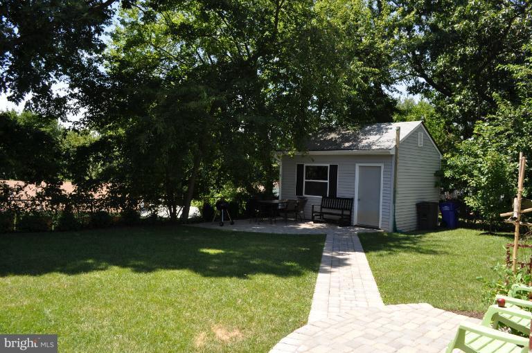 2916 Weisman Road Silver Spring, MD 20902 - Photo 14 of 19 a view of a backyard with couches plants and large tree