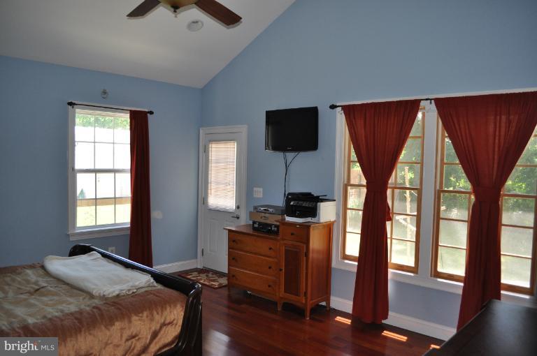 2916 Weisman Road Silver Spring, MD 20902 - Photo 18 of 19 a bedroom with a bed and a window
