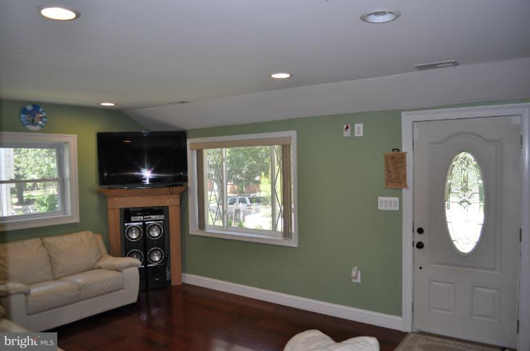 2916 Weisman Road Silver Spring, MD 20902 - Photo 9 of 19 a living room with furniture and a fireplace