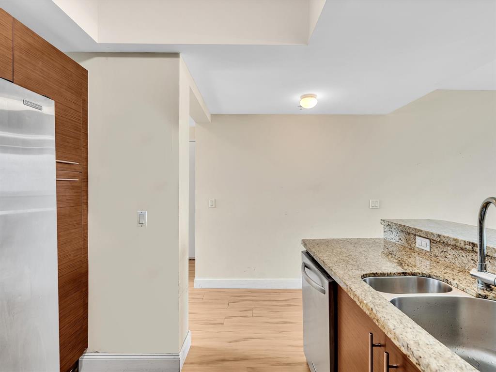 2681 North Flamingo Road, Unit 2104S Fort Lauderdale, FL 33323 - Photo 13 of 99 a kitchen with stainless steel appliances granite countertop a sink and a refrigerator