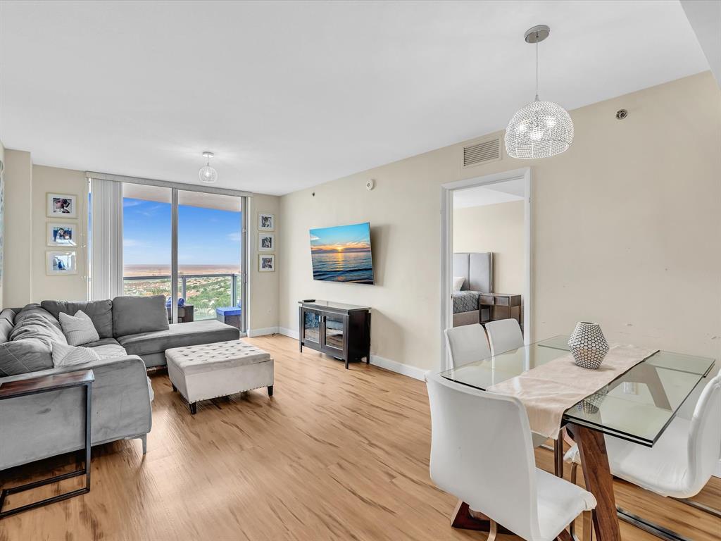2681 North Flamingo Road, Unit 2104S Fort Lauderdale, FL 33323 - Photo 14 of 99 a living room with fireplace furniture and a wooden floor