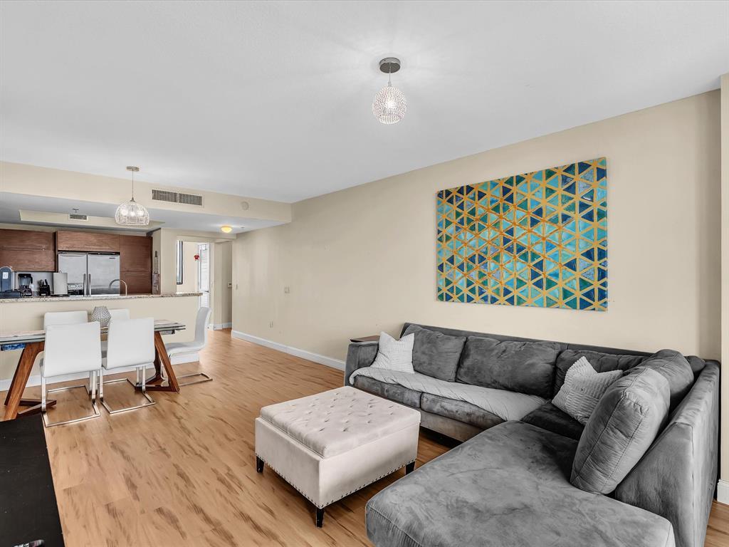 2681 North Flamingo Road, Unit 2104S Fort Lauderdale, FL 33323 - Photo 24 of 99 a living room with furniture and wooden floor