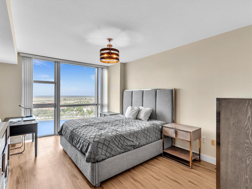 2681 North Flamingo Road, Unit 2104S Fort Lauderdale, FL 33323 - Photo 37 of 99 a bedroom with a bed and a table