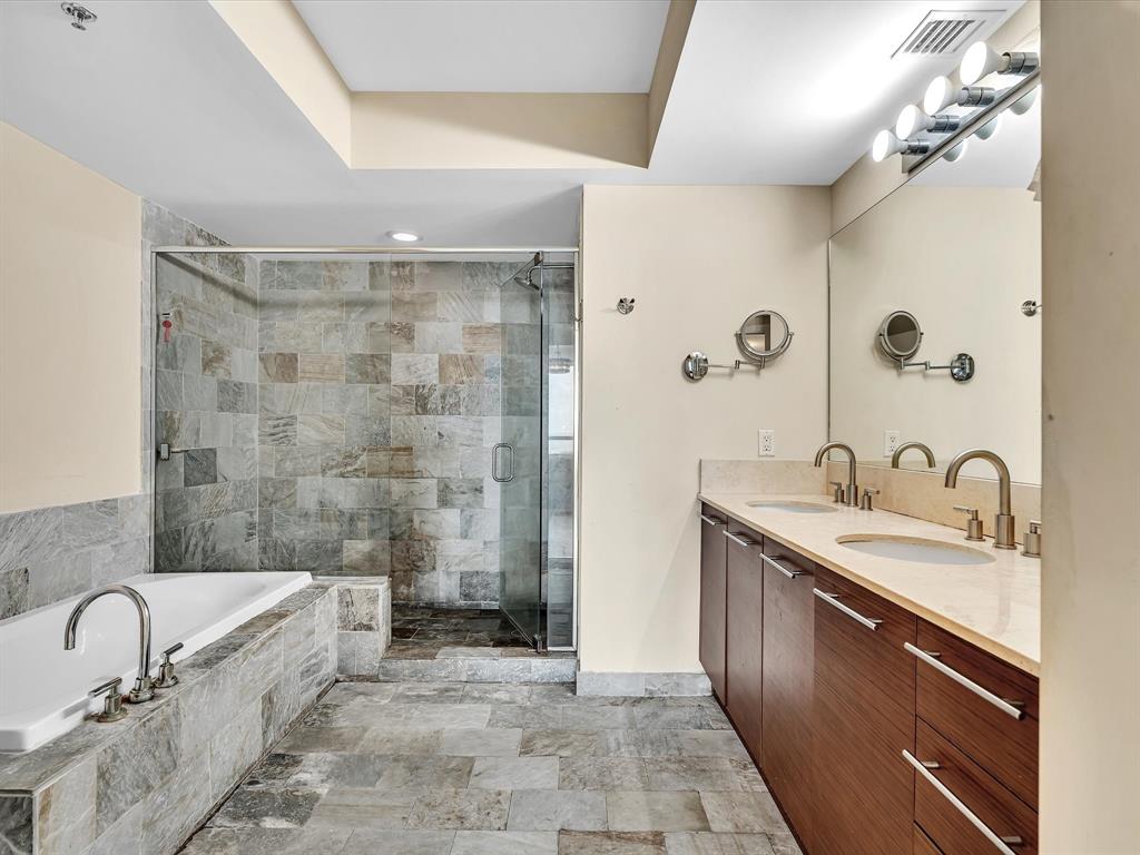 2681 North Flamingo Road, Unit 2104S Fort Lauderdale, FL 33323 - Photo 41 of 99 a spacious bathroom with a granite countertop sink a mirror and a bathtub