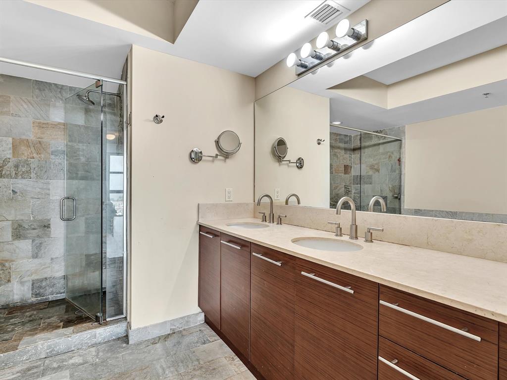 2681 North Flamingo Road, Unit 2104S Fort Lauderdale, FL 33323 - Photo 42 of 99 a bathroom with a double vanity sink mirror and shower