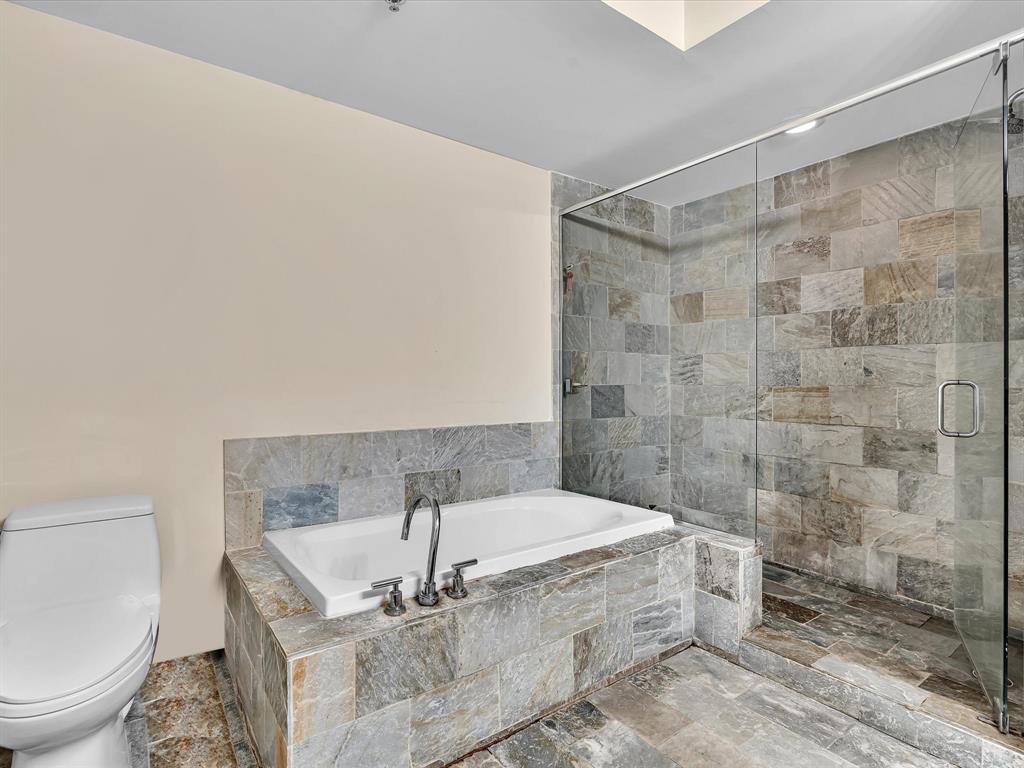 2681 North Flamingo Road, Unit 2104S Fort Lauderdale, FL 33323 - Photo 45 of 99 a bathroom with a granite countertop bathtub shower and toilet