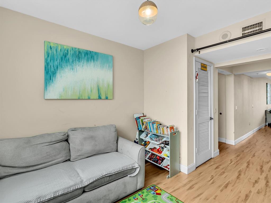 2681 North Flamingo Road, Unit 2104S Fort Lauderdale, FL 33323 - Photo 50 of 99 a living room with furniture and a flat screen tv