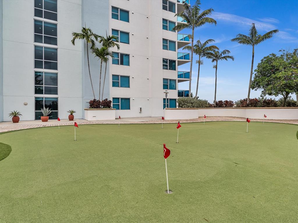 2681 North Flamingo Road, Unit 2104S Fort Lauderdale, FL 33323 - Photo 97 of 99 a view of a swimming pool with a lawn chairs
