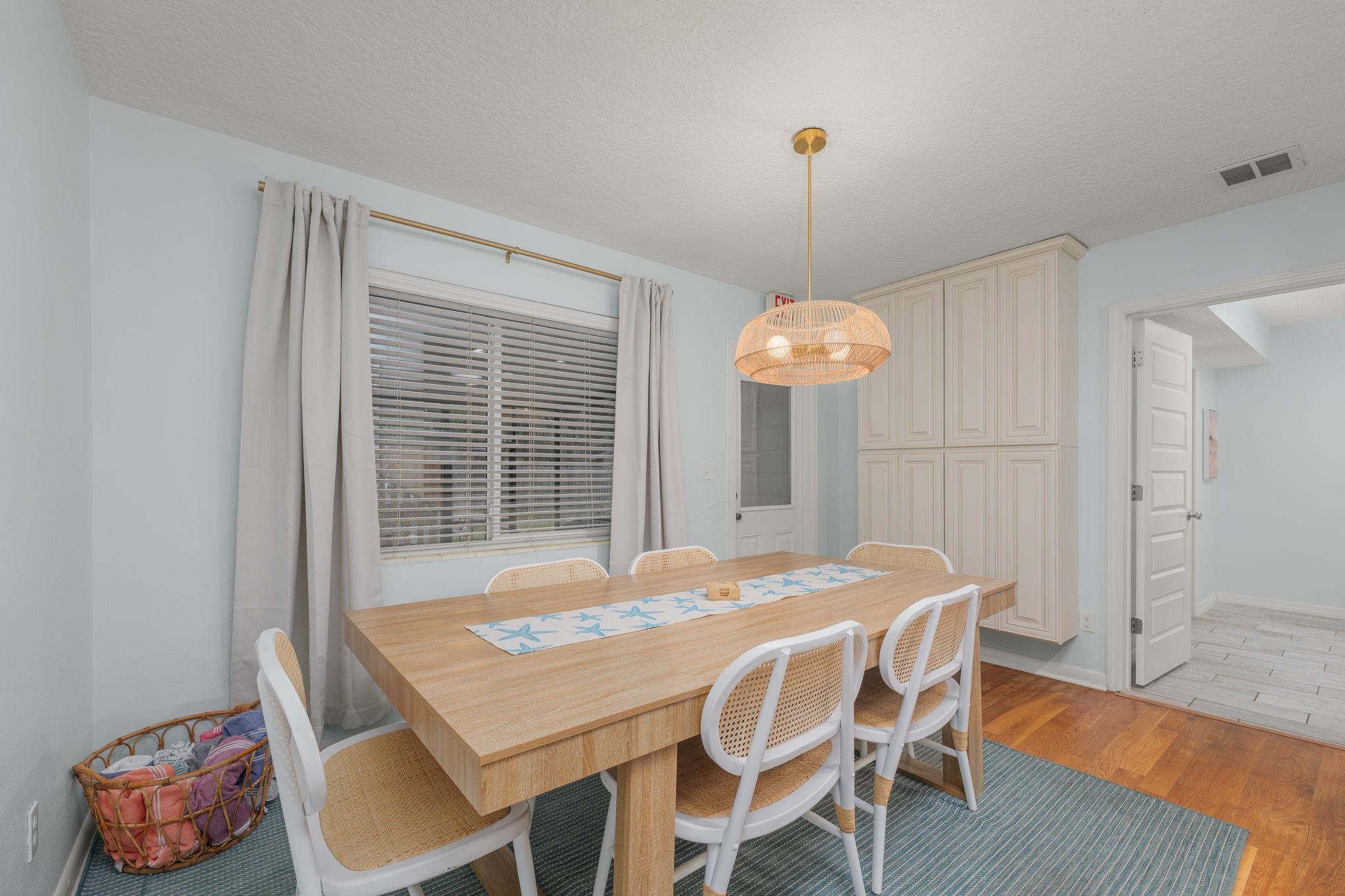 119 Menendez Road St. Augustine, FL 32080 - Photo 11 of 40 a view of a dining room with furniture window and wooden floor