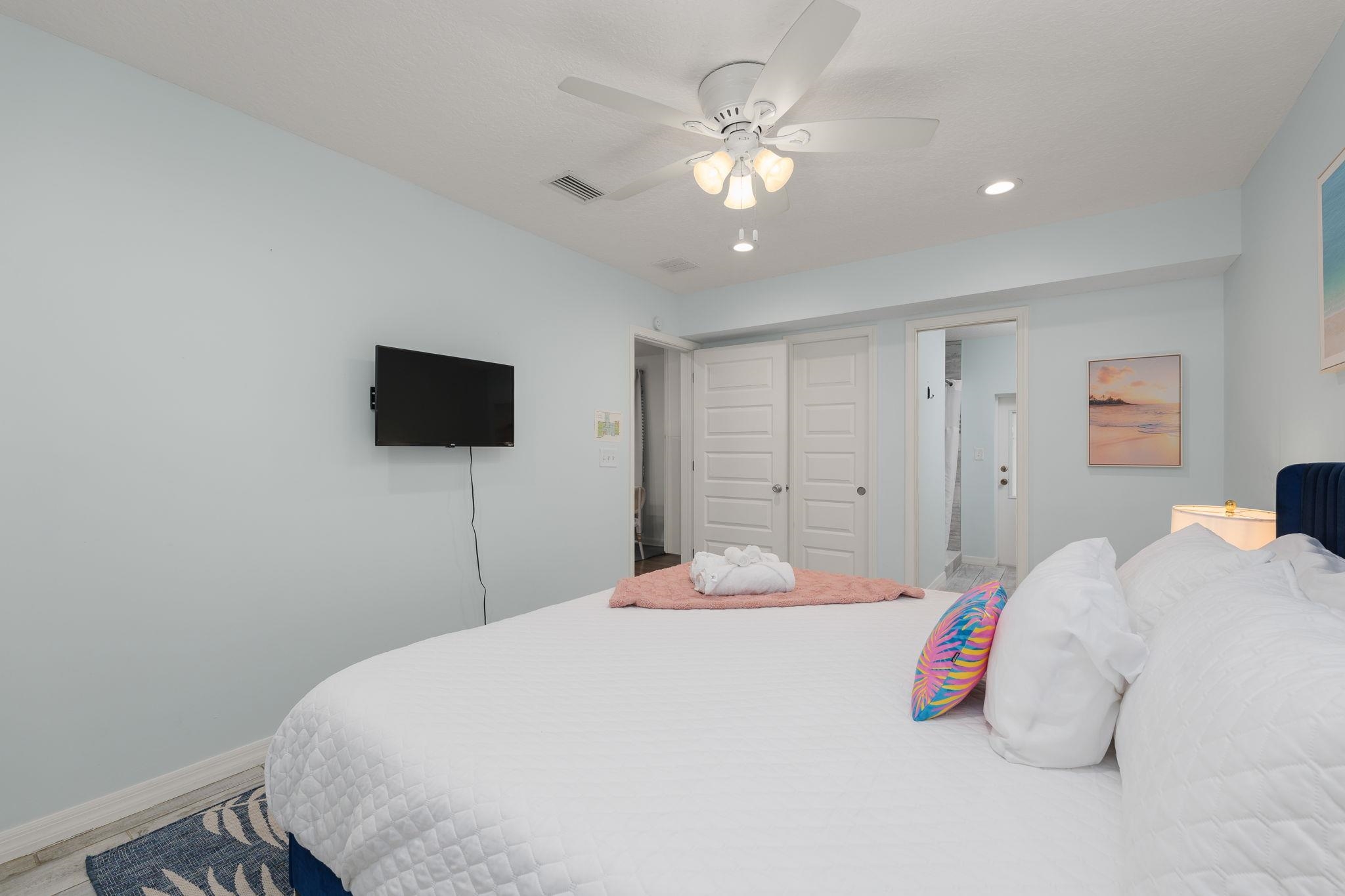 119 Menendez Road St. Augustine, FL 32080 - Photo 13 of 40 a bedroom with a bed and a flat screen tv