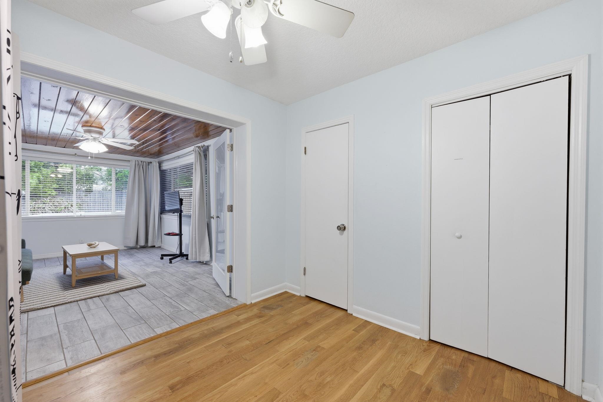 119 Menendez Road St. Augustine, FL 32080 - Photo 24 of 40 a view of a bedroom with a bed and wooden floor